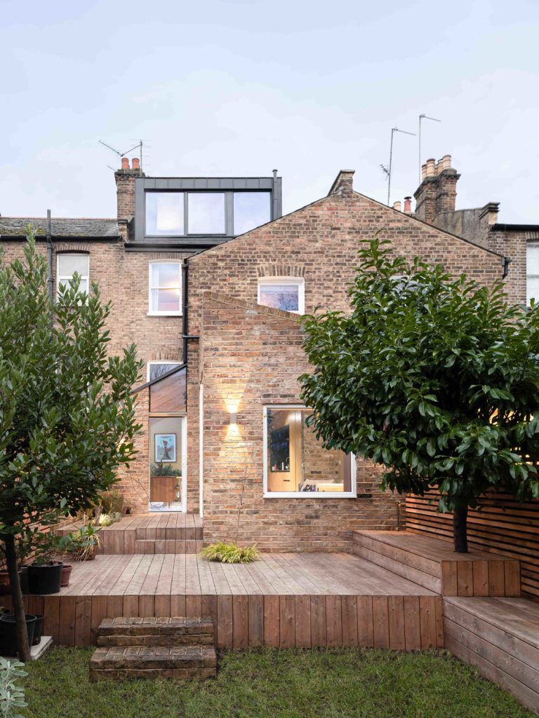 Stepped extensions made up side down house fit in with its conservation area surroundings