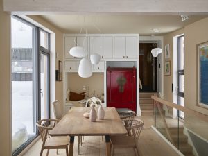 Red Chioiserie cabinet within a new kitchen