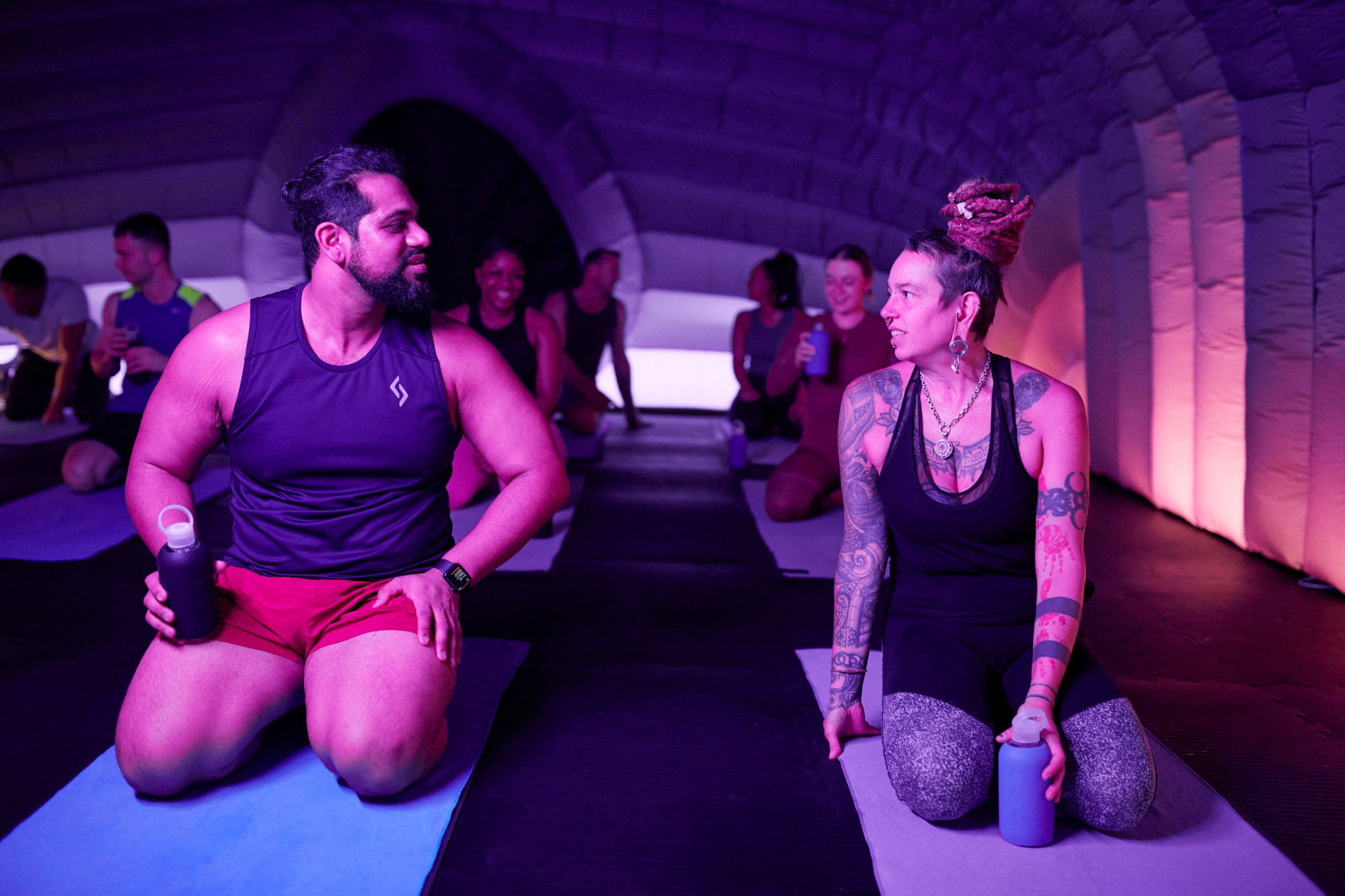 two people preparing to do yoga